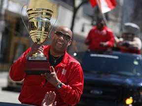 Windsor Express head coach, Bill Jones, shows off the NBL of Canada championship trophy during the Windsor Express championship parade on Ouellette Ave., Saturday, April 26, 2014.  (DAX MELMER/The Windsor Star)