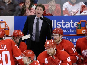 Detroit Red Wings head coach Mike Babcock directs his team during the third period of Game 3 of a first-round NHL hockey playoff series against the Boston Bruins in Detroit, Tuesday, April 22, 2014. (Carlos Osorio/The Associated Press)