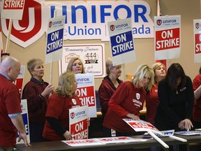 Caesars Windsor employees, members of Unifor Local 444 prepare strike signs Tuesday, April 1, 2014, at the Unifor union hall in Windsor, Ont. The strike deadline is this upcoming Friday.  (DAN JANISSE/The Windsor Star)