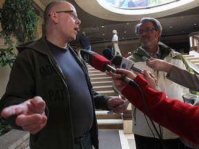 Caesars Windsor employee Jim Tone (L) a security worker at the facility cast his ratification vote Tuesday, April 8, 2014, at the Caboto Club in Windsor, Ont. (DAN JANISSE/The Windsor Star)