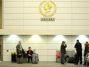 Caesars Windsor guests wait for transportation after all guests at the Casino were told to leave due to the possibility of a strike at Caesars Windsor Hotel and Casino, Thursday, April 3, 2014.  (DAX MELMER/The Windsor Star)