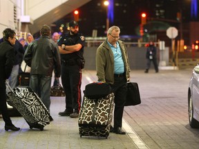 Caesars Windsor guests wait for transportation after all guests at the Casino were told to leave due to the possibility of a strike at Caesars Windsor Hotel and Casino, Thursday, April 3, 2014.  (DAX MELMER/The Windsor Star)