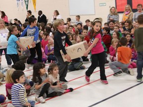 St. Antoine French Catholic school students present boxes of art and craft supplies Wednesday in memory of former fellow student Daniel Ethier who died of cancer in June at the age of 14.  The boxes were a surprise donation to his pediatric oncology nurse Ursula DeBono and Child Life specialist Lisa Galbraith of Windsor Regional HospitalÕs Met campus.  The presentation was made at St. Antoine French Catholic School, Wednesday. (JASON KRYK/The Windsor Star)