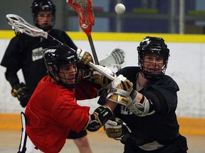 Trevor Learn and Kellen LeClair (right) of the Windsor Clippers take part in a practice at Forest Glade Arena in Windsor on Tuesday, April 22, 2014.  (TYLER BROWNBRIDGE/The Windsor Star)