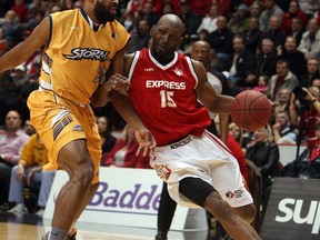 The Windsor Express' Quinnel Brown charges into the Island Storm's Dwayne Smith at the WFCU Centre in Windsor on Tuesday, April 15, 2014.                    (TYLER BROWNBRIDGE/The Windsor Star)