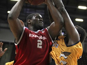 Windsor's DeAndre Thomas, left, makes a strong move to the basket while being defended by the Island Storm's Casey Love during Game 2 of the NBL Canada Finals between the Windsor Express and the Island Storm at the WFCU Centre, Sunday, April 6, 2014.  (DAX MELMER/The Windsor Star)