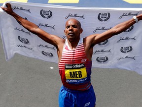 Meb Keflezighi of the United States celebrates after winning the 118th Boston Marathon on April 21, 2014 in Boston, Massachusetts.  (Photo by Jim Rogash/Getty Images)