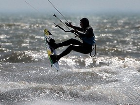 A kitesurfer jumps a wave on a very choppy Lake Erie near Kingsville on April 10, 2014.  (JASON KRYK/The Windsor Star)
