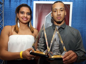 Female and male athletes of the year Miah-Marie Langlois and Khaliel James (right) except their awards during the 9th annual WESPY Awards at the Caboto Club in Windsor on Tuesday, April 15, 2014.                    (TYLER BROWNBRIDGE/The Windsor Star)
