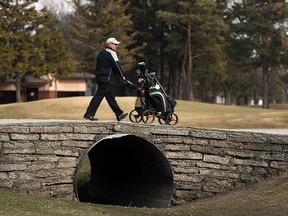 Ian Pillon golfs on opening day at Roseland Golf and Curling Club in Windsor on Wednesday, April 2, 2014.                         (TYLER BROWNBRIDGE/The Windsor Star)