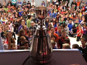 More than 600 students and staff from St. William Catholic Elementary school get a rare glimps of the Canadian Football League's Grey Cup on April 15, 2014.    The Grey Cup arrived at the school Tuesday as a result of the kind gesture by Tina Camlis.   Camlis was the national winner of the Lowe's Canada "Bring Home the Cup"  contest.   Camlis was the winner chose from thousands across the Country.  Camlis chose to bring the Grey Cup to her child's school. (JASON KRYK/ The Windsor Star)