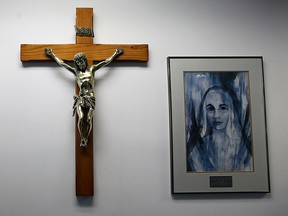 A crucifix and painting hang on the wall at Holy Names Catholic high school. (Windsor Star files)