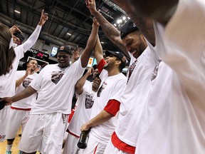 The Windsor Express celebrate after beating the Island Storm in Game 7 of the NBL championship final at the WFCU Centre in Windsor on Thursday, April 17, 2014. (TYLER BROWNBRIDGE/The Windsor Star)