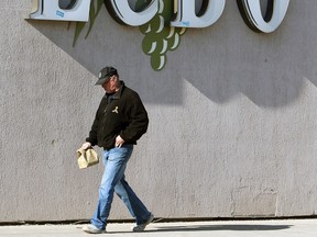 In this file photo, a customer exits the LCBO store in downtown Windsor on Tuesday, April 1, 2014.                         (TYLER BROWNBRIDGE/The Windsor Star)