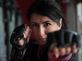 Mixed martial artist Randa Markos throws a punch during a workout at Maximum Training Centre in Windsor, Ontario. (JASON KRYK/The Windsor Star)
