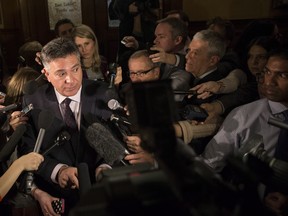 Ontario Finance Minister Charles Sousa might look like a deer in the headlights during a Queen's Park scrum, but it's taxpayers who should fear his budget. THE CANADIAN PRESS/Chris Young