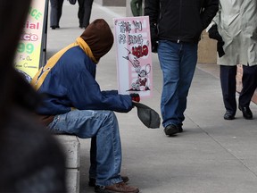 A downtown Windsor panhandler is shown in this 2013 file photo. (Nick Brancaccio / The Windsor Star)