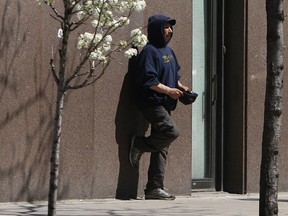 A panhandler on Ouellette Avenue is shown in this 2011 file photo. (Tyler Brownbridge / The Windsor Star)