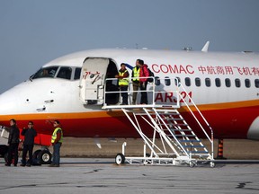 A chinese marked airplane sits on the ramp at Windsor Airport in Windsor on Wednesday, April 2, 2014.                         (TYLER BROWNBRIDGE/The Windsor Star)