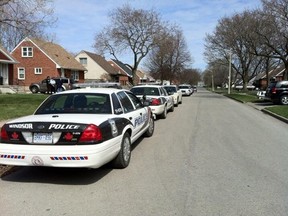 Windsor police cruisers line the 1200 block of Rankin Avenue, near the residence of 11-year-old Kirubel Masresha, on April 24, 2014. (Dalson Chen / The Windsor Star)