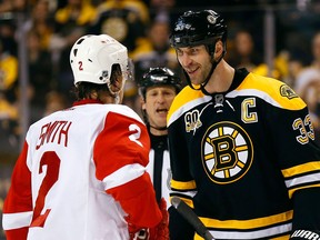 Boston Bruins' Zdeno Chara (33) stares at Detroit Red Wings' Brendan Smith during the first period of Game 2 of a first-round NHL hockey playoff series in Boston Sunday, April 20, 2014. (AP/Winslow Townson)