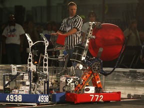 Robots compete in an aerial assist match at the First Robotics Competition at the St. Denis Centre, Friday, April 4, 2014.  (DAX MELMER/The Windsor Star)