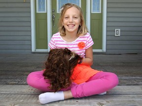 Elise Stammler, 10, is pictured at her home, Saturday, April 19, 2014, with the hair she and five others had cut in order to raise money for Aubri Andre, 7, who is battling a rare form of Leukemia.  Stammler raised a total of $910 for Aubri.  (DAX MELMER/The Windsor Star)