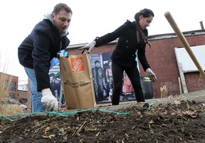 The United Way of Windsor-Essex County launched a youth volunteer challenge program on Monday, April 7, 2014, at the Ford City community garden in Windsor, Ont. The aim of the challenge is to get youth involved in their community. Aaron Botton and Shadan Shirin-Bayan weed through some soil. (DAN JANISSE/The Windsor Star)