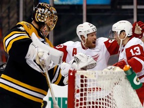 Red Wings centre Pavel Datsyuk, right, celebrates a goal with teammate Johan Franzen after scoring against Boston Bruins goalie Tuukka Rask, left, during the third period of Detroit's 1-0 win in Boston in this 2014 file photo.