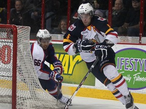 Windsor's Josh Ho-Sang chases Barrie's Aaron Ekblad around the net  during their game at the WFCU Centre in Windsor on Feb. 27. (DAN JANISSE / The Windsor Star)