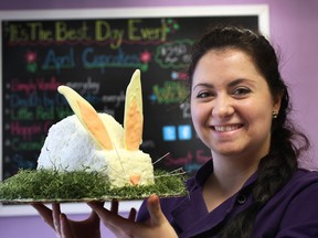 Saskia Scott, owner of the Sweet Revenge Bake Shop in Windsor, displays an Easter bunny cake. (DAN JANISSE / The Windsor Star)