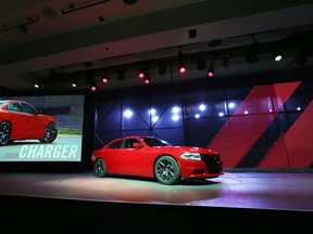 The 2015 Dodge Charger is revealed at the New York International Auto Show in New York City. (EPA / JASON SZENES)