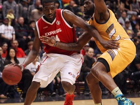 The Windsor Express' Chris Commons cuts around the Island Storm's Casey Love at the WFCU Centre in Windsor during Game 1 of the NBL championship series on Friday. On Monday, Commons was one of three Express players to be named to play in the league's all-star game taking place later this month. (TYLER BROWNBRIDGE / The Windsor Star)