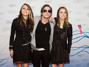 Courage My Love arrive on the red carpet during the Juno Awards in Winnipeg on March 30. (John Woods / The Canadian Press)