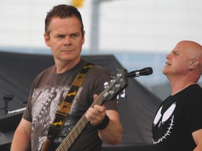 Drop Dead Famous bass guitarist Scott Holmes, left, and background vocalist Chris Blais perform at Beaverfest '13 at the Riverfront Amphitheatre last June. (Rob Benneian / For The Windsor Star)