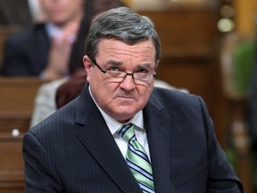 Finance Minister Jim Flaherty tables the federal budget in Ottawa on Feb. 11. Flaherty died April 10at age 64. (THE CANADIAN PRESS / Fred Chartrand)
