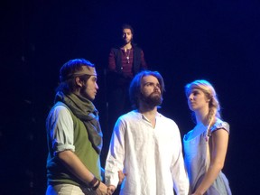 Josh Mercado as Peter, left, Mark Gallagher as Jesus, Angela Zieleniewski as Mary Magdelan and Andrew Meloche as Judas, background, rehearse a scene from St. Clair College’s production of Jesus Christ Superstar. (JASON KRYK / The Windsor Star)
