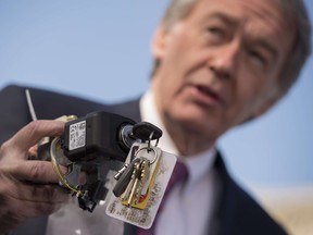 U.S. Senator Edward Markey, D-Massachusetts, holds up a faulty General Motors ignition switch during a news conference with the family members of deceased drivers on Capitol Hill in Washington, D.C., on April 1. General Motors chief executive Mary Barra faced tough questioning in Congress last week over why the company ignored a faulty ignition problem for a decade despite numerous accident reports and 13 deaths. (JIM WATSON / AFP / Getty Images)