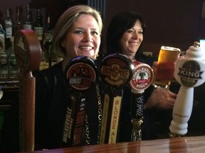 NDP Leader Andrea  Horwath has a brew along with NDP candidate Lisa Gretzky at Brews and Cues grill in West Windsor Thursday May 8, 2014. (Julie Kotsis/The Windsor Star)