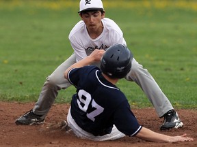 Massey's Brandon Carr, front, is caught stealing by Riversid's Aaron Curtis-Atkins during high school baseball action at Riverside Friday, May 9, 2014. (TYLER BROWNBRIDGE/The Windsor Star)