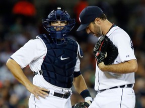 Detroit catcher Alex Avila, left, talks with pitcher Justin Verlander during the seventh inning against the Minnesota Twins at Comerica Park. (Photo by Duane Burleson/Getty Images)