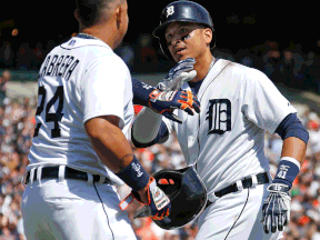 Detroit's Victor Martinez, right, celebrates his three-run homer with Miguel Cabrera during the seventh inning against the Minnesota Twins at Comerica Park Saturday. (Photo by Gregory Shamus/Getty Images)