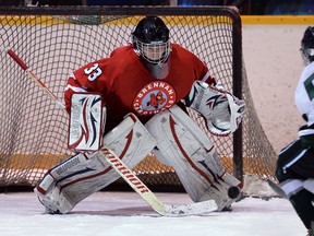 Belle River's Riley Meyerink, right, is stopped by Brennan goalie Josh Breault at Lakeshore Arena. (DAN JANISSE/The Windsor Star)