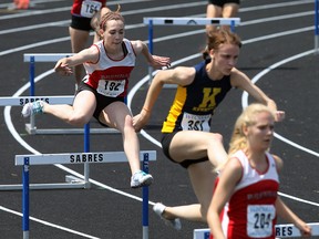 Shae-Lyn MacIssac, from left, Stephanie Scane and Kaden Roy compete in the women's 400m hurdles at the high school track meet at Sandwich Tuesday. (TYLER BROWNBRIDGE/The Windsor Star)