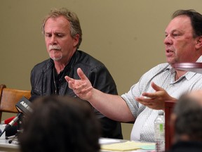 Unifor Local 195 President Gerry Farnham, left, and Unifor national rep and lead negotiator Mike Renaud, right, address the media and their membership at the union's office on Somme Avenue, Thursday May 15, 2014. (NICK BRANCACCIO/The Windsor Star)