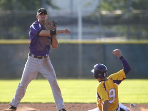 Tecumseh's Ryan Kerstens, left, throws out Windsor's Nick Koutoula at second base at Cullen Field. (DAN JANISSE/The Windsor Star)