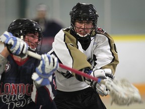 Windsor's Tyler McDowall, right, and London's Mackenzie Wilkinson battle at Forest Glade Arena. (DAN JANISSE/The Windsor Star)