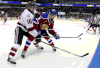 Tecumseh's Kerby Rychel, left, battles for the puck with Edmonton's Griffin Reinhart during the second period at the Memorial Cup in London Saturday. (THE CANADIAN PRESS/Dave Chidley)