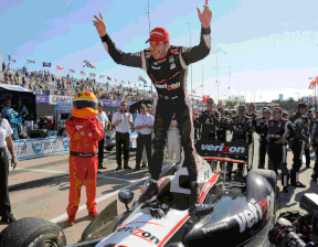 Will Power stands on his car after winning the first race of the IndyCar Chevrolet Detroit Belle Isle Grand Prix doubleheader in Detroit in 2013.