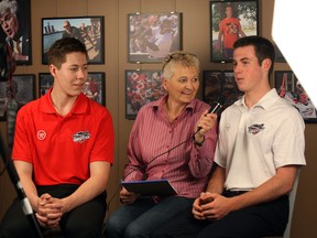 Newest Windsor Spitfires Logan Stanley, left, and Blake Coffey are interviewed by The Star's Mary Caton at News Cafe Monday May 12, 2014. (NICK BRANCACCIO/The Windsor Star)